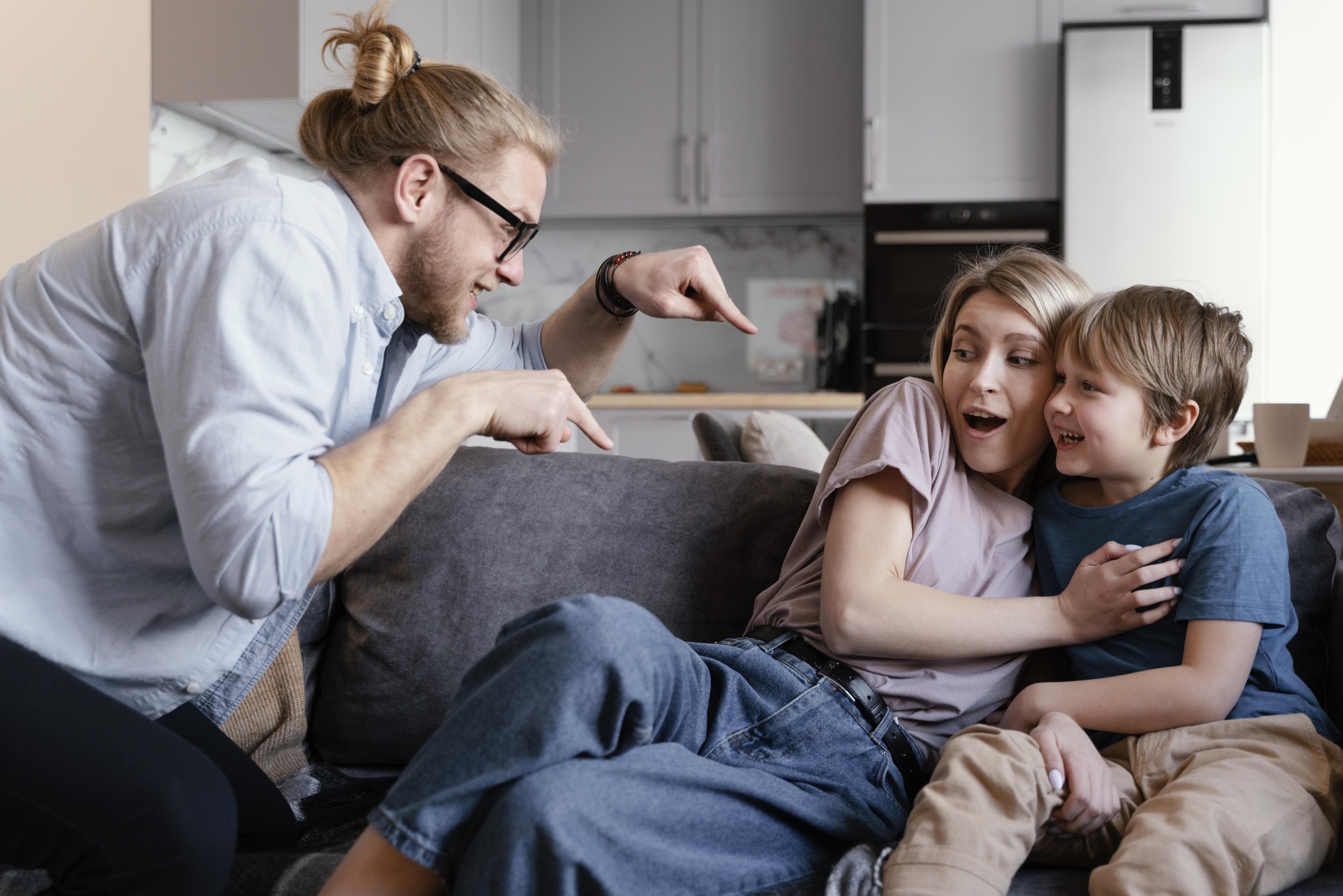 1 medium-shot-parents-kid-having-fun.jpg