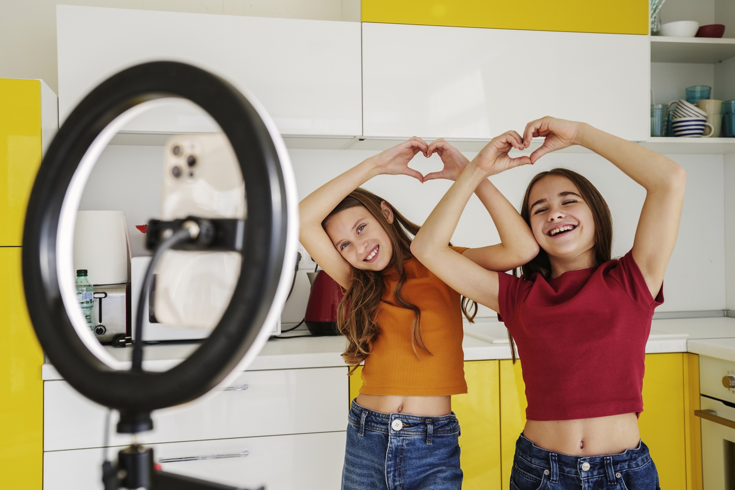 1 girl-cousins-spending-time-together-home-playing-front-ring-light.jpg