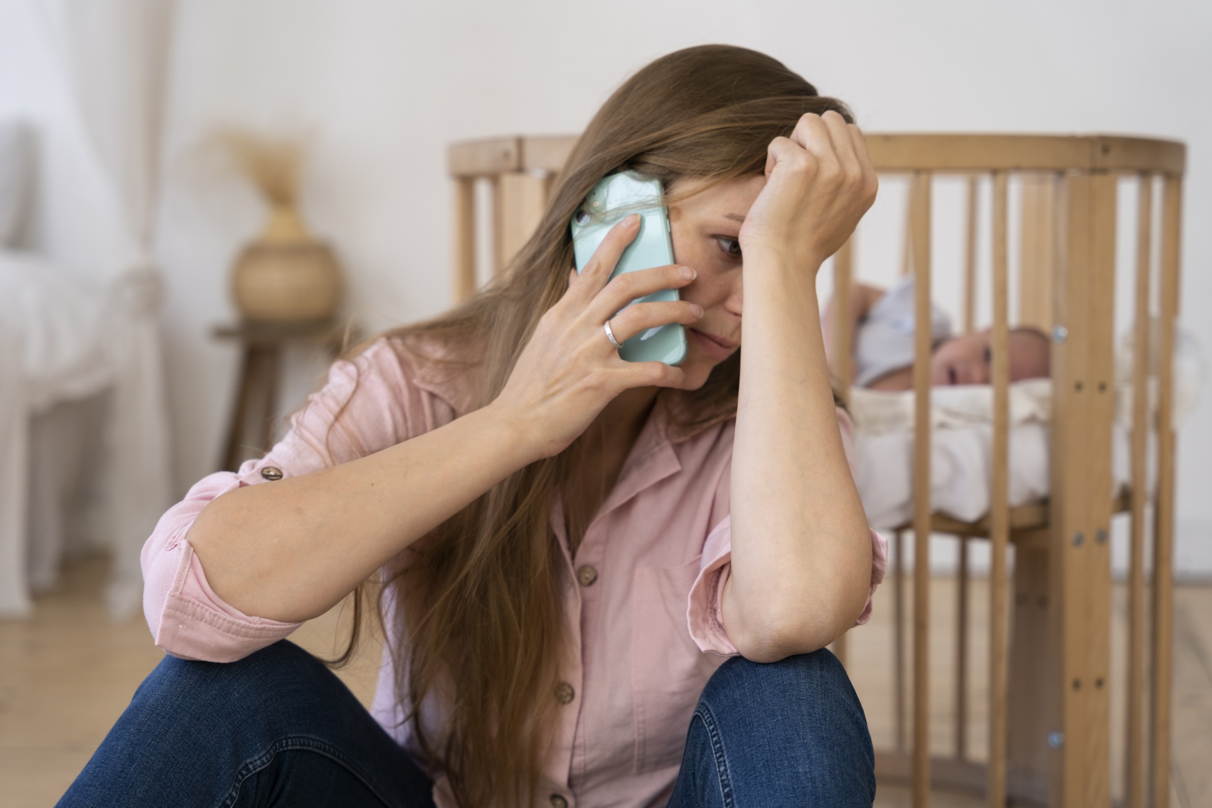 close-up-tired-mom-taking-care-newborn-baby.jpg